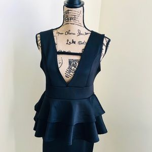 Deep V black peplum dress
